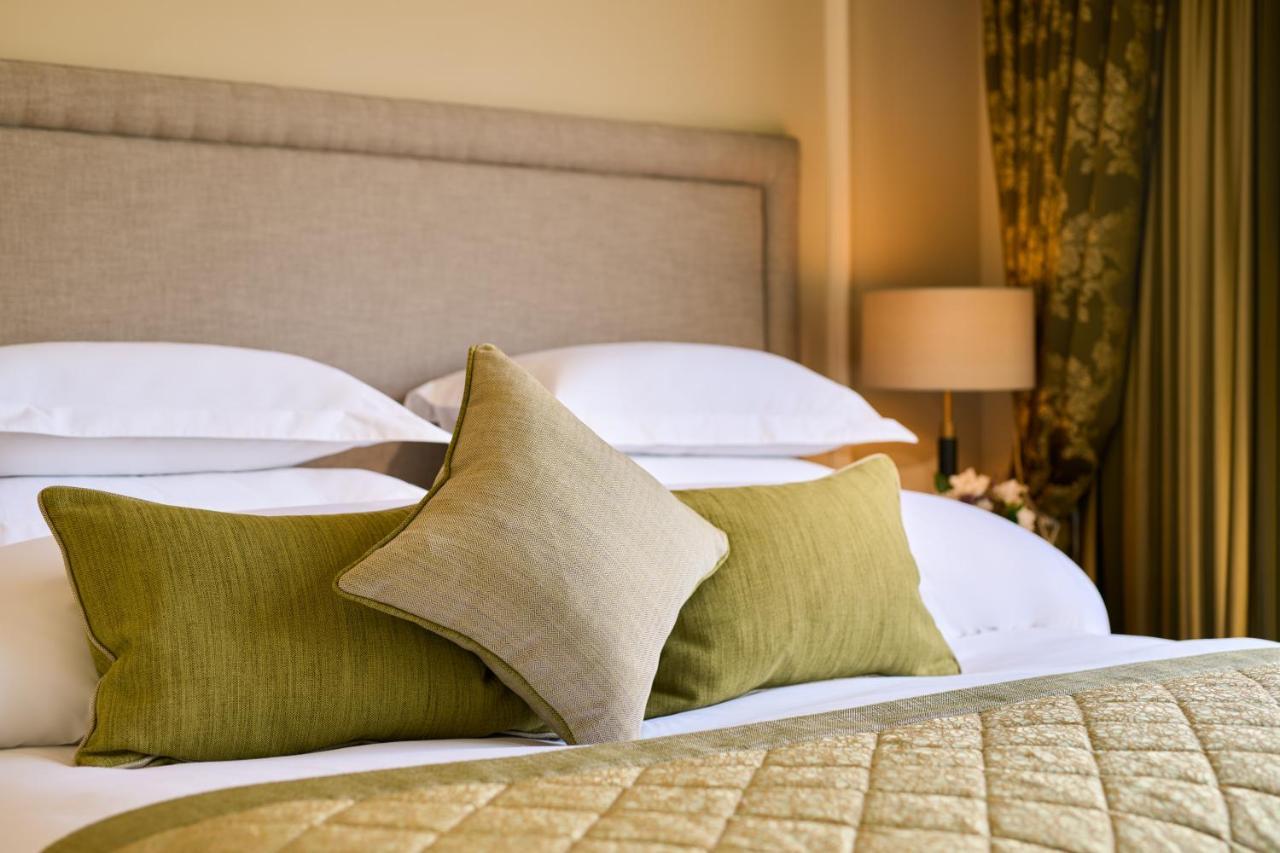 Castlemartyr Resort Hotel Экстерьер фото A bed with cushions